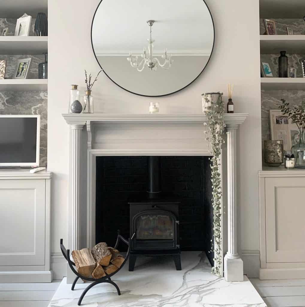 round_mirror_above_fireplace_4