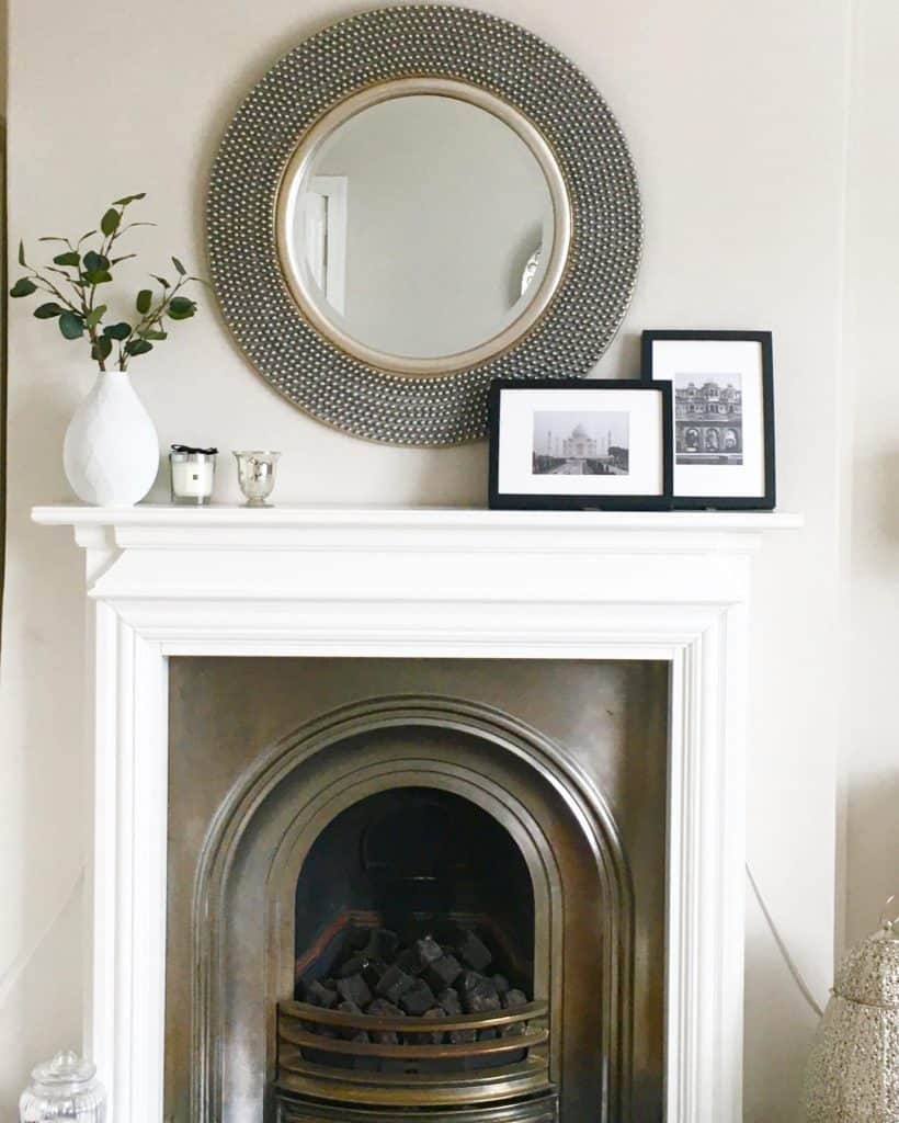 round_mirror_above_fireplace_6