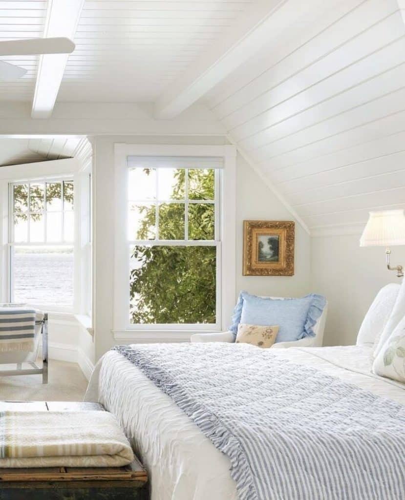 Cozy_Coastal_Attic_Bedroom_with_White_Be_