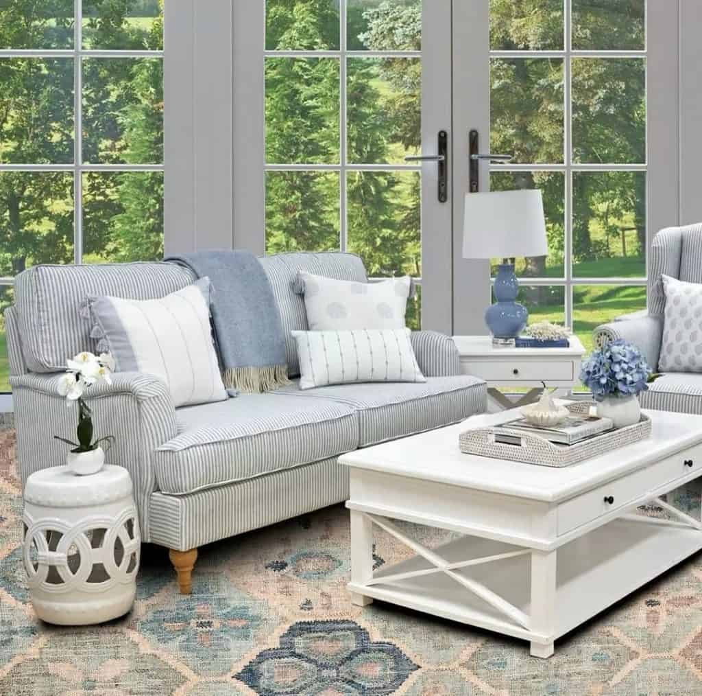 Inviting_Sunroom_with_Blue_Ornamental_Ru_2