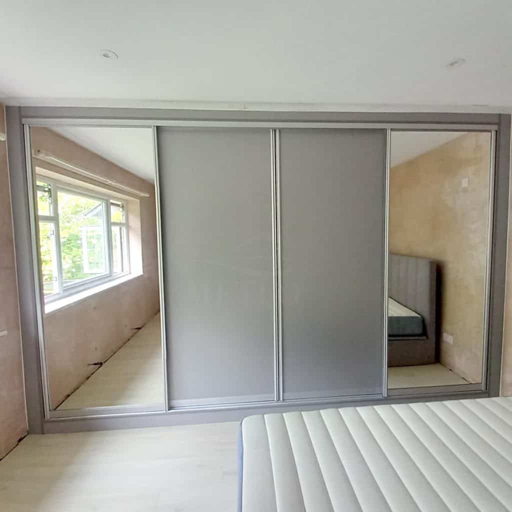 Sleek_Built-In_Bedroom_Cabinet_with_Mirr