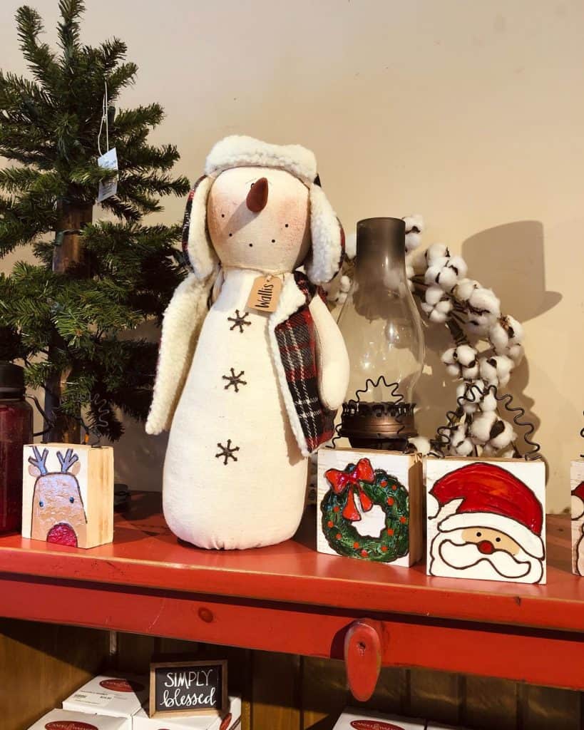 A_Festive_Shelf_Display_Featuring_a_Snow_1