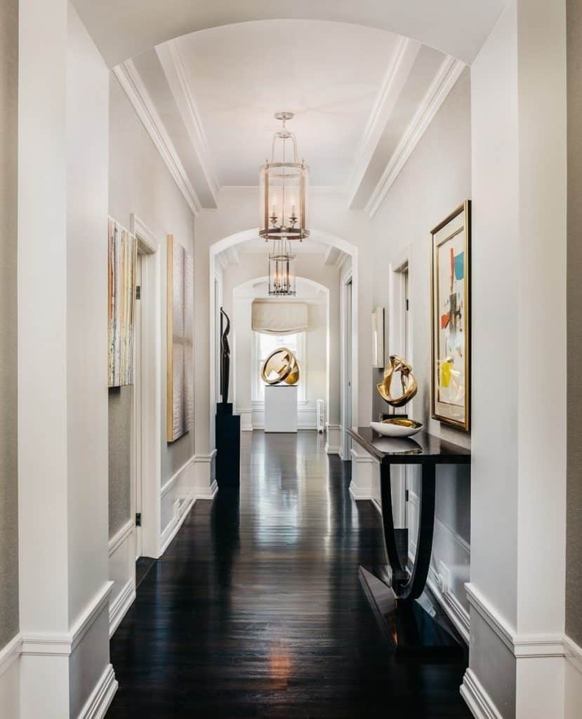 A_Hallway_With_White_Walls_and_Black_Har_5