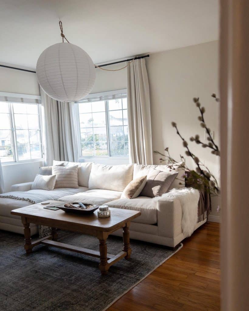 A_Living_Room_With_a_White_Sectional_and_1