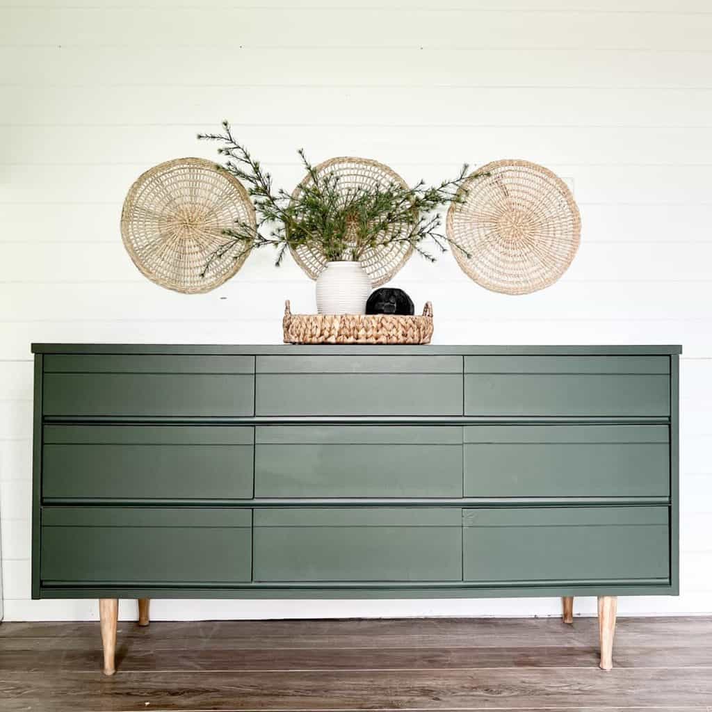 A_Vintage_Dresser_In_Front_of_a_White_Wa_5