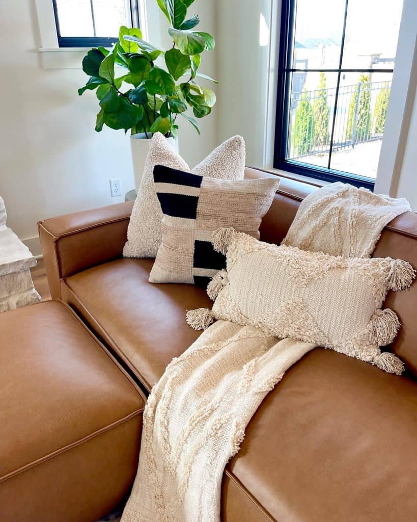 Brown_Leather_Couch_Accented_with_Assort_