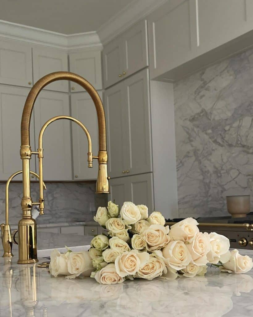 Elegant_Gold_Faucet_and_White_Marble_Cou_3