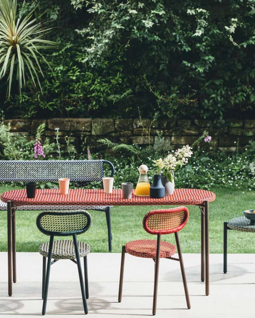 Outdoor_Dining_Set_Surrounded_by_Lush_Ga_