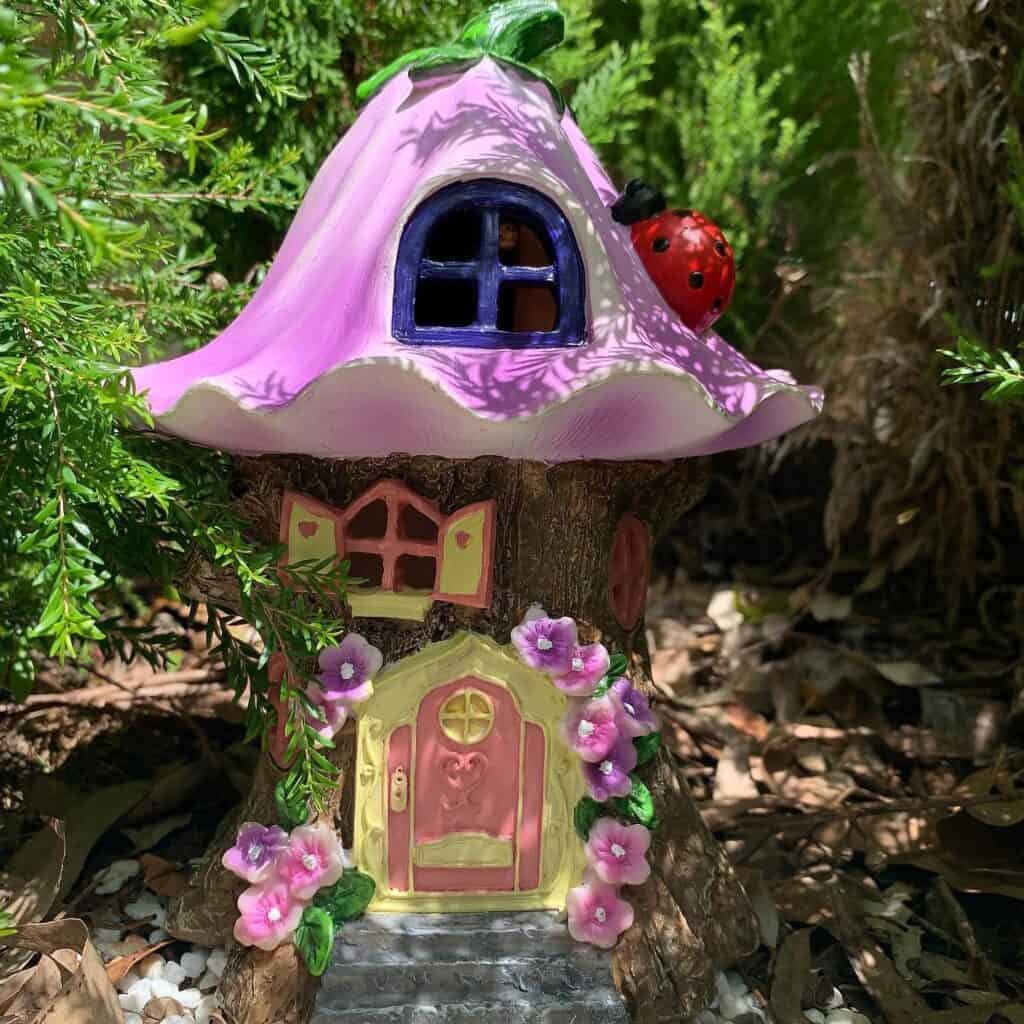 A_Charming_Purple_Fairy_House_with_a_Lad