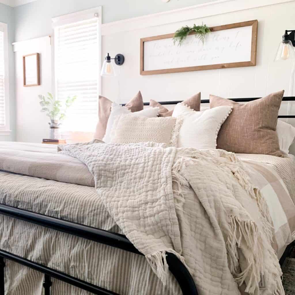 A_Cozy_Bed_with_Plentiful_Pillows_and_Be_3