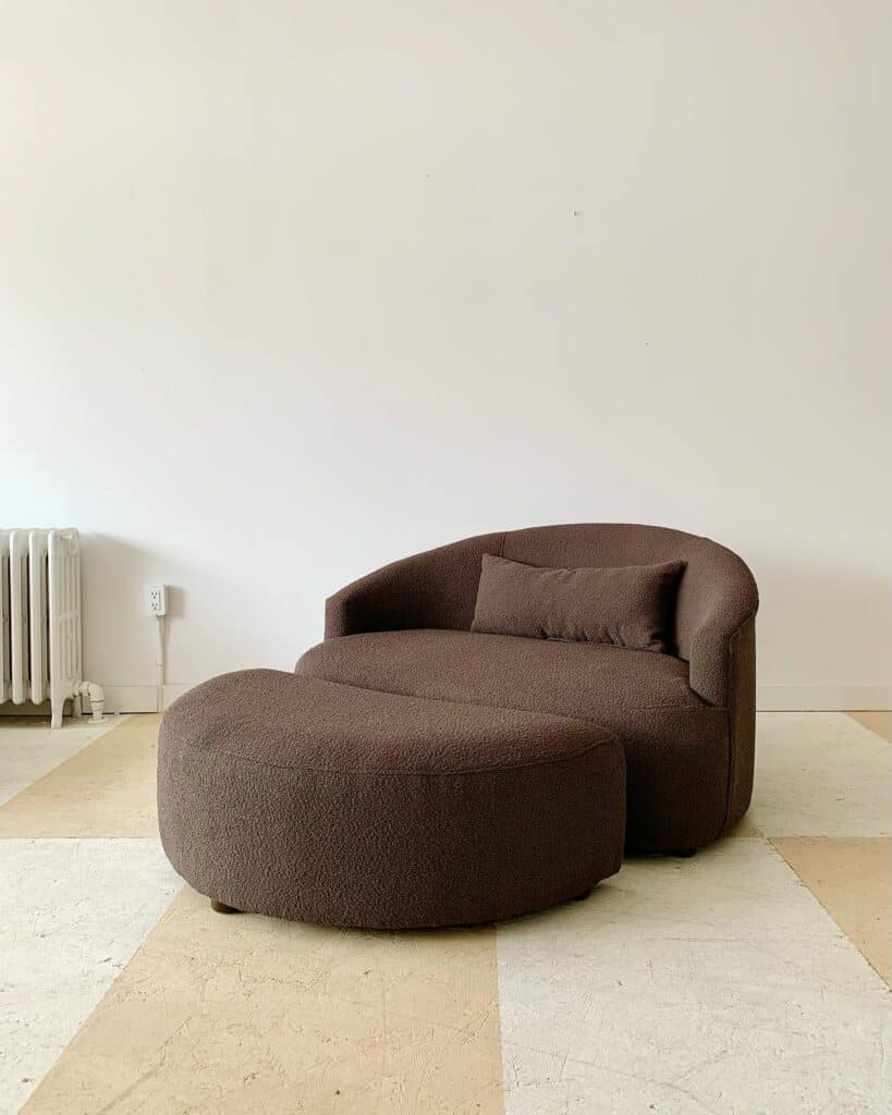 A_Brown_Round_Lounge_Chair_Placed_Promin_2