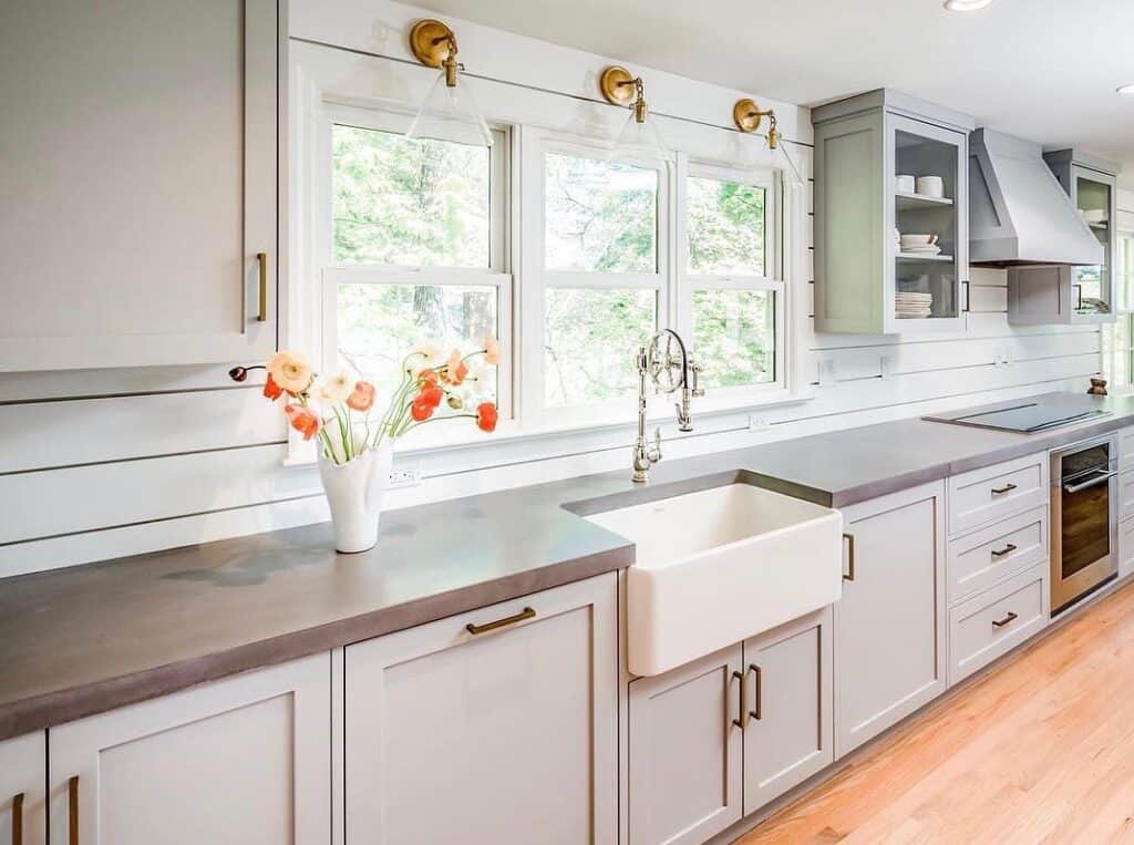 A_Kitchen_with_White_Cabinets_and_a_Wood_5