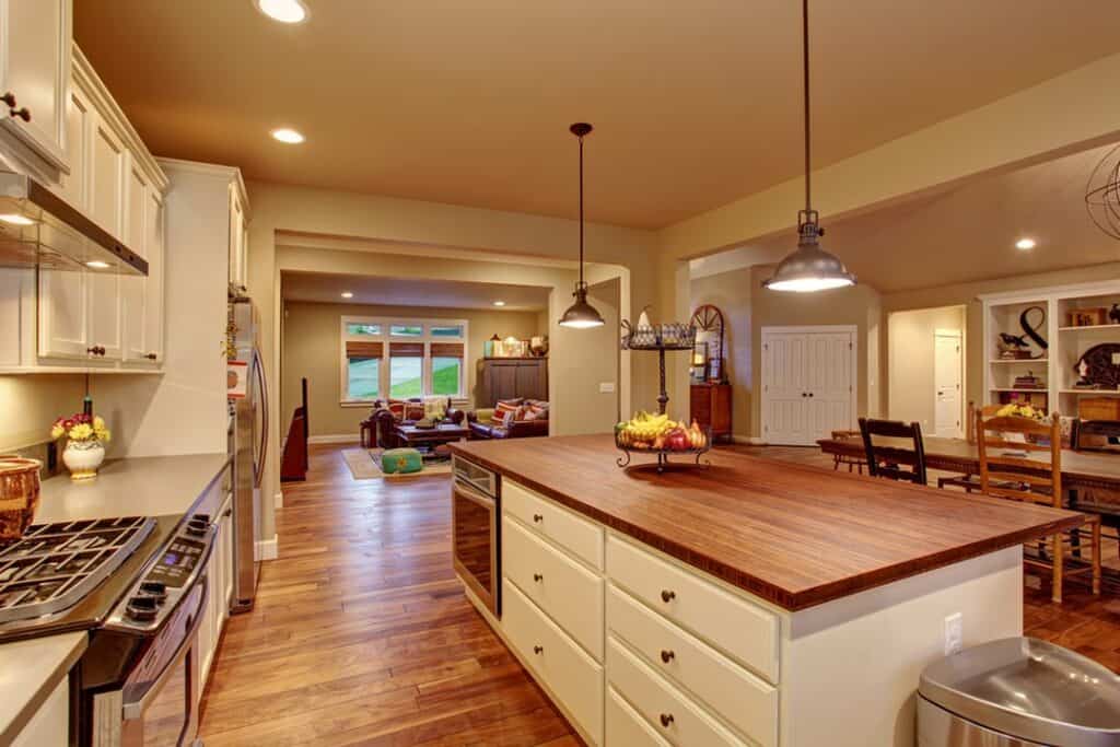 A_Kitchen_with_White_Cabinets_and_a_Wood_7