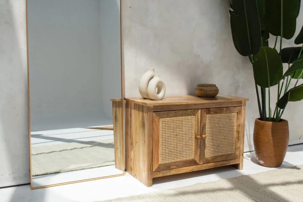 A_Rattan_Side_Table_with_a_Mirror_and_Pl_2
