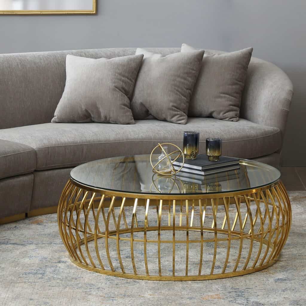 A_Round_Brass_Coffee_Table_in_a_Gray_Liv_4