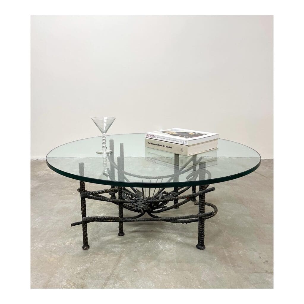 A_Sleek_Glass_Coffee_Table_with_Metal_Le_4