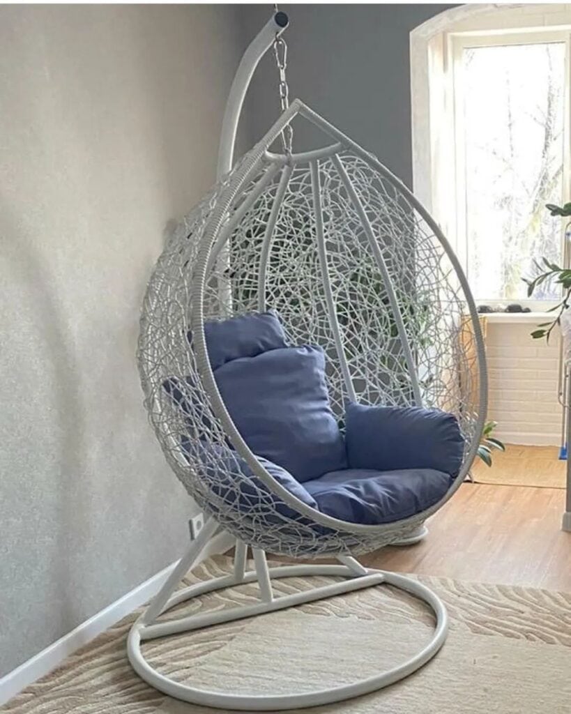 A_White_Hanging_Chair_With_Blue_Cushions_5