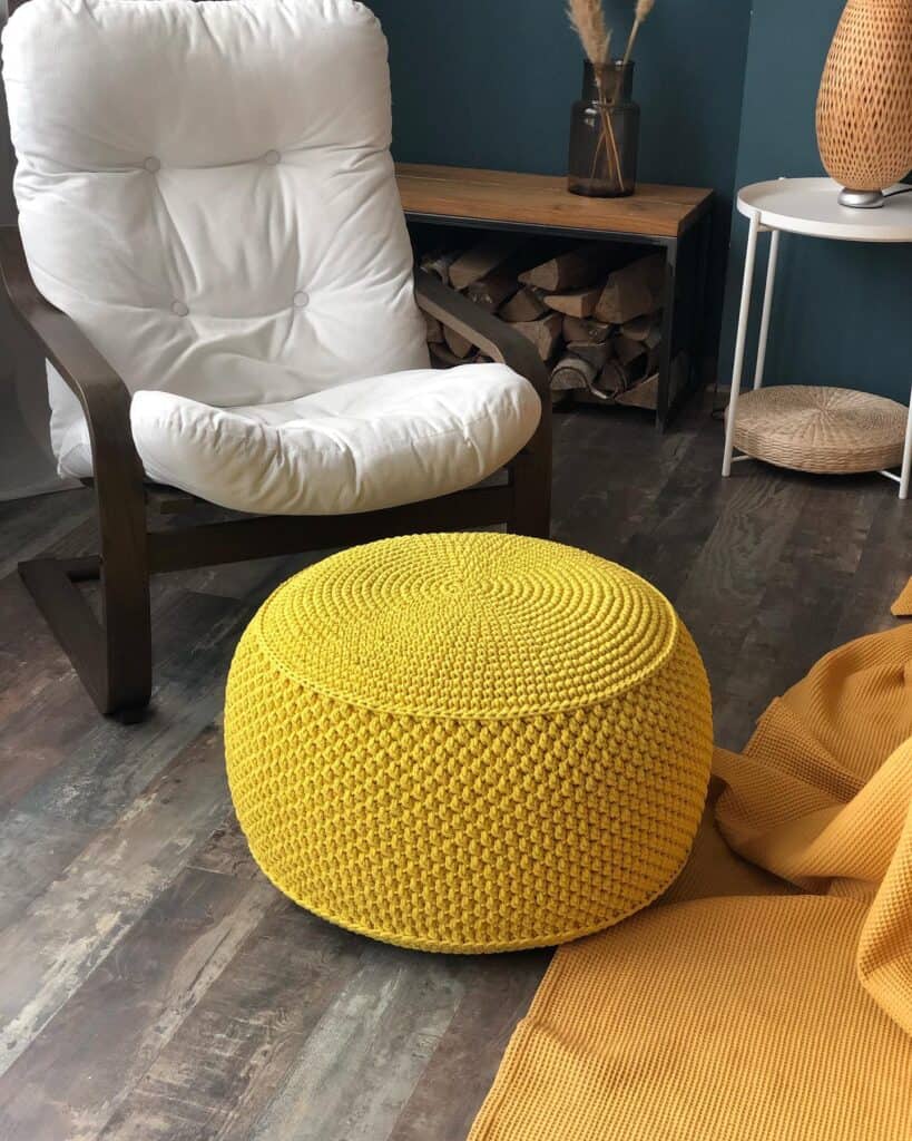 An_Elegant_Yellow_Knitted_Pouf_Next_to_a_1