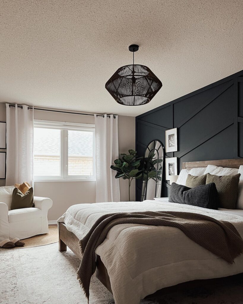 A_Bedroom_with_Black_Accent_Wall_and_Whi_4