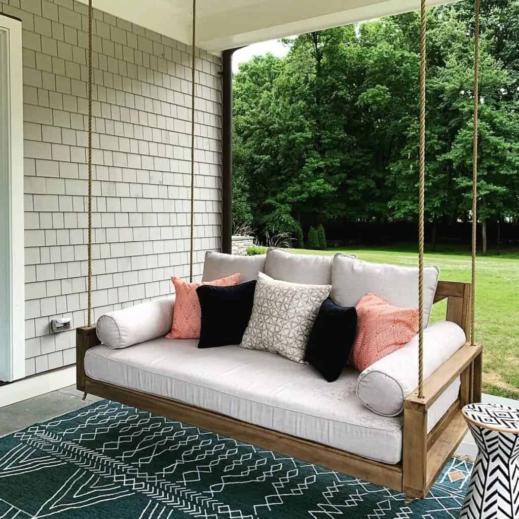 Stylish_Porch_Swing_With_Vibrant_Pink_Pi_