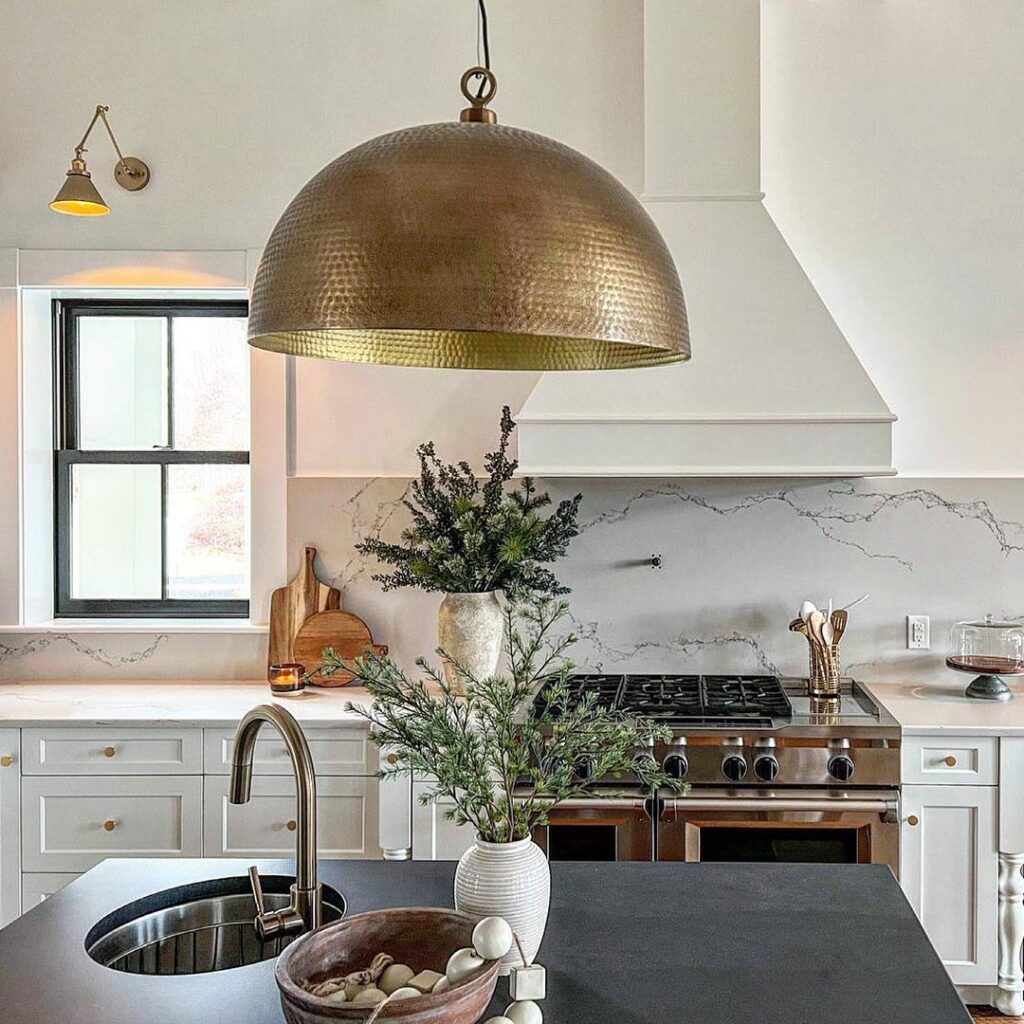 A_Brass_Pendant_Light_Illuminates_a_Blac_2