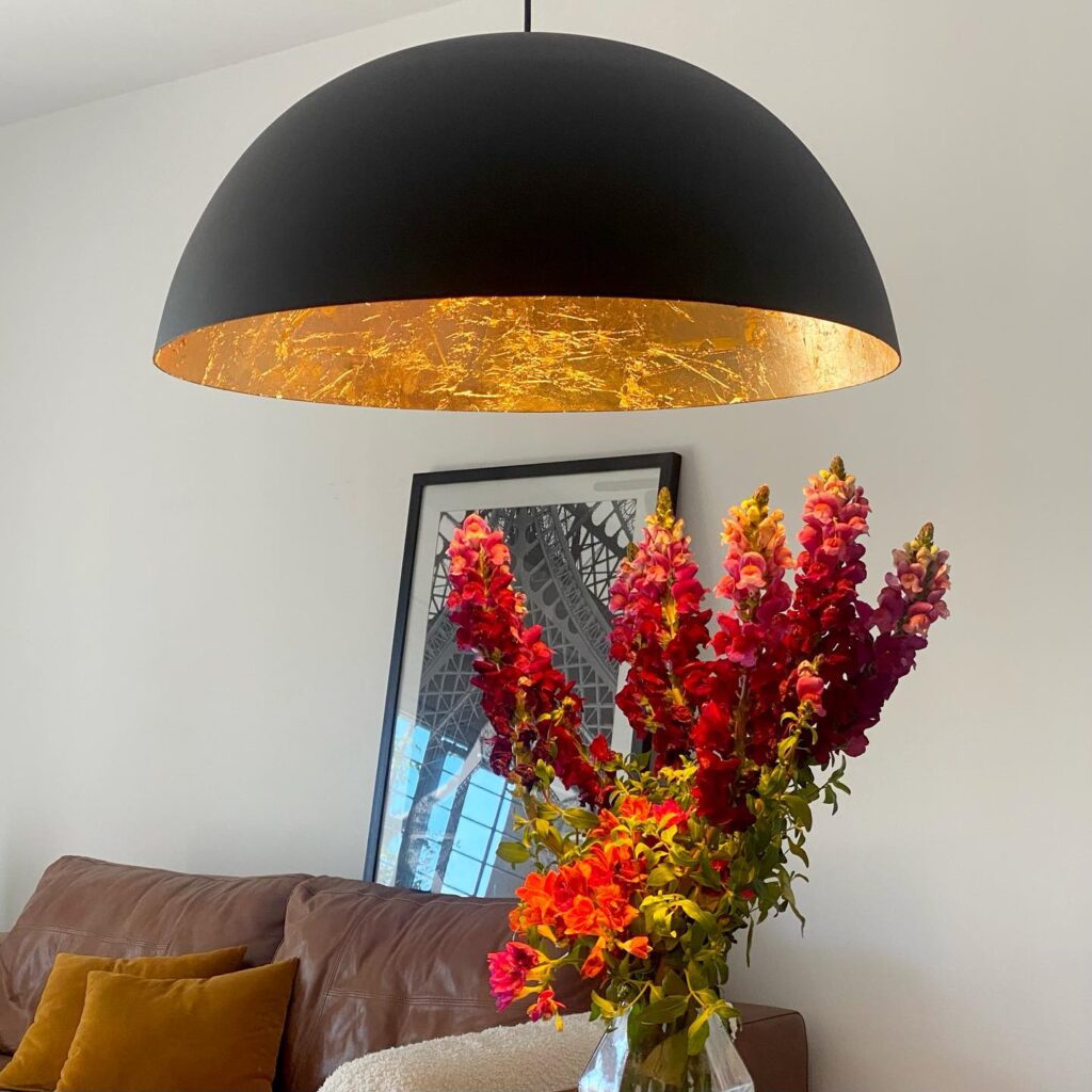 A_Stylish_Pendant_Light_Above_a_Leather__2