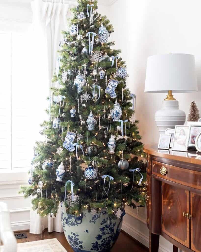 white_christmas_tree_with_blue_and_silver_decorations_
